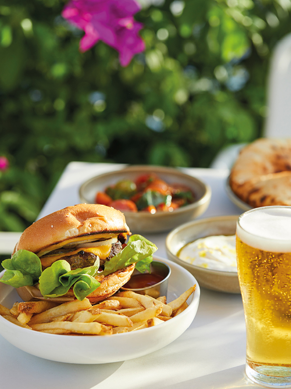 Cheeseburger with fries and a cold beer served at Cheeky Dog, Bannisters Port Stephens.