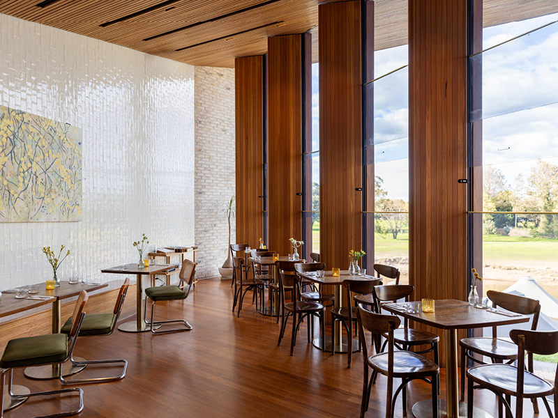 Interior of Acacia Dining in Maitland, upstairs dining area with timber finishes, large windows, and modern decor.