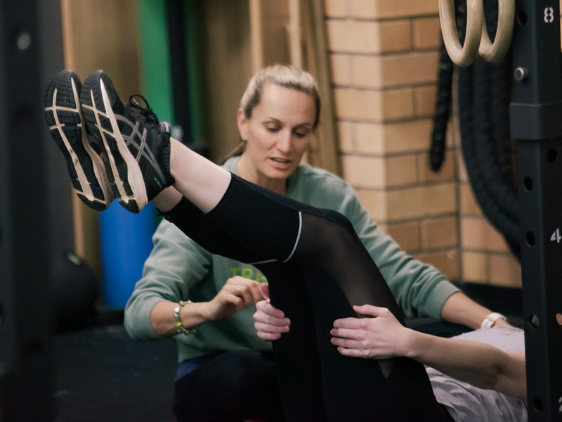 Jacci Allanson, owner of Transcend Health Newcastle, coaching a client during a strength and movement session.