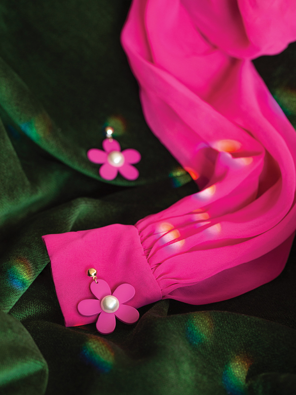 Pink chiffon blouse and floral earrings from The Retro Wardrobe Newcastle on green velvet.